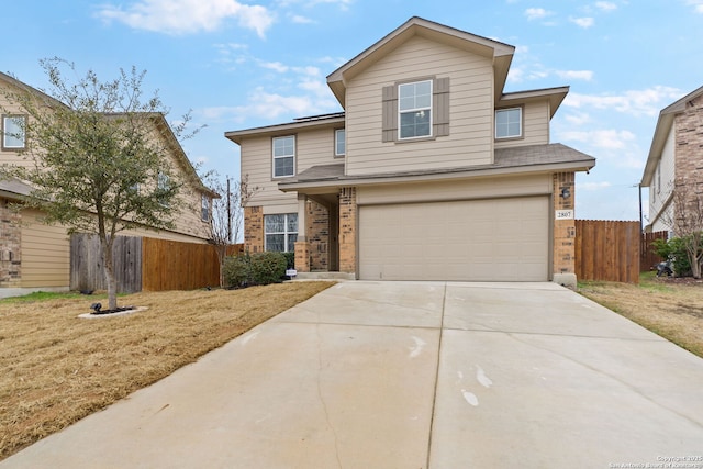 front facade with a garage and a front lawn