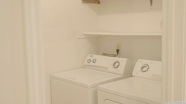 laundry room with independent washer and dryer