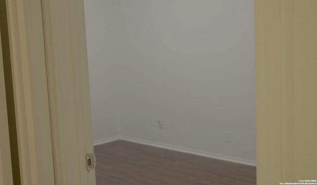 unfurnished room with hardwood / wood-style floors