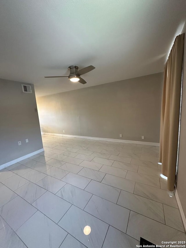 unfurnished room with ceiling fan