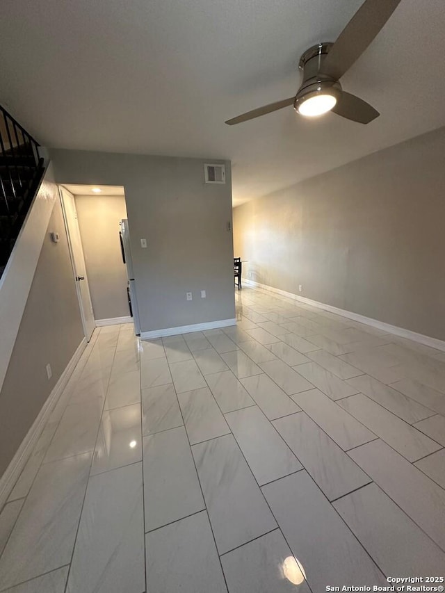 unfurnished room with ceiling fan