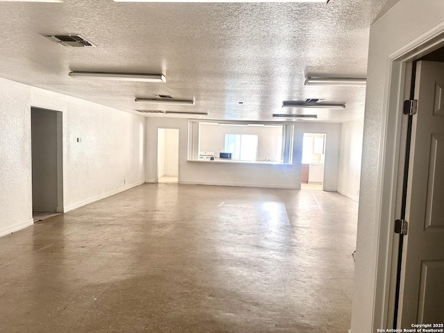 unfurnished living room with a textured ceiling