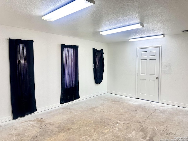 empty room with a textured ceiling