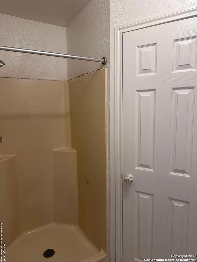 bathroom with a shower