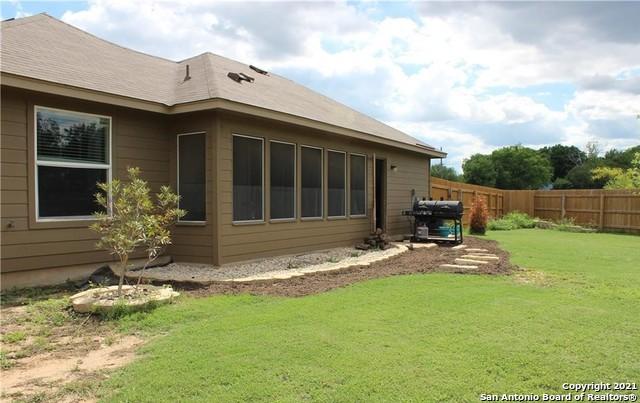 view of side of property featuring a lawn