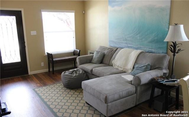 living room with dark hardwood / wood-style floors