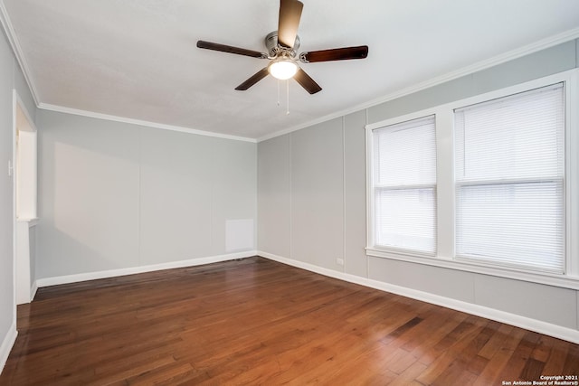 unfurnished room featuring dark wood-type flooring, ceiling fan, and ornamental molding