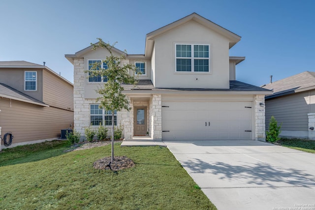 view of front of property with a garage and a front lawn