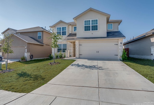 view of front property with a garage and a front lawn