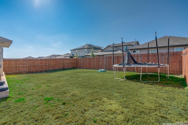 view of yard featuring a trampoline