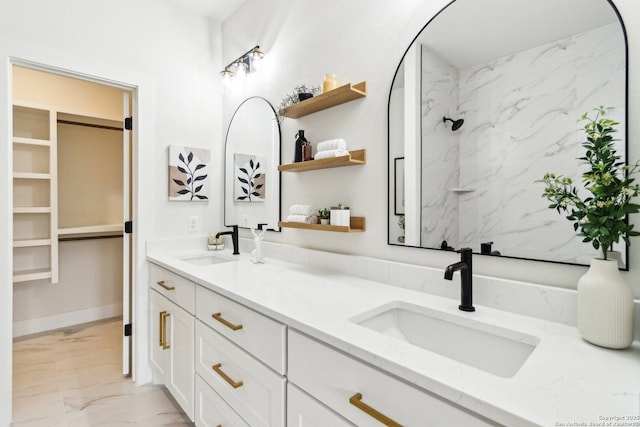 bathroom with vanity and a shower