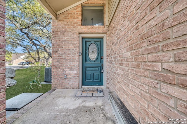 entrance to property featuring central AC