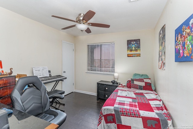 bedroom with dark hardwood / wood-style flooring and ceiling fan