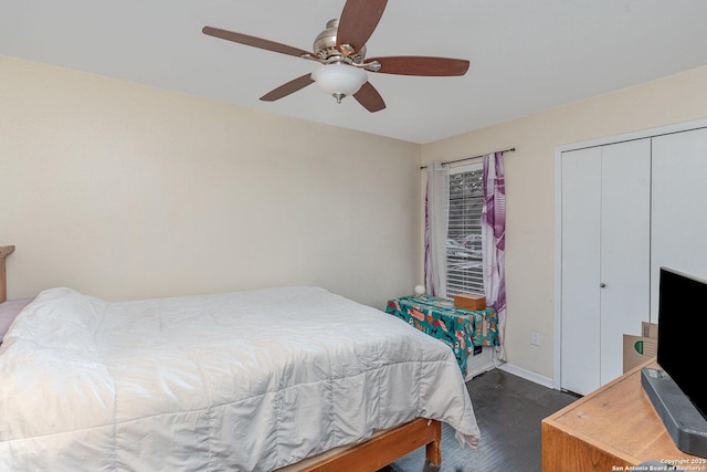 bedroom featuring dark hardwood / wood-style flooring, a closet, and ceiling fan