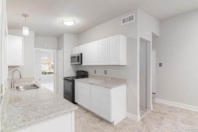 kitchen with pendant lighting, sink, white cabinets, light stone counters, and black range with electric cooktop