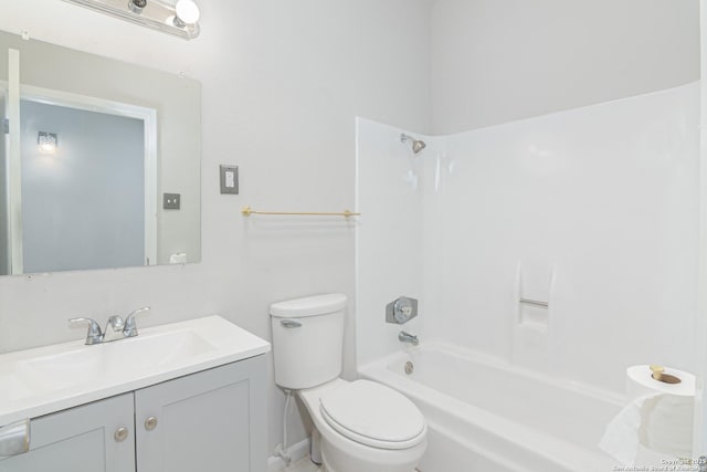 full bathroom featuring vanity, tub / shower combination, and toilet