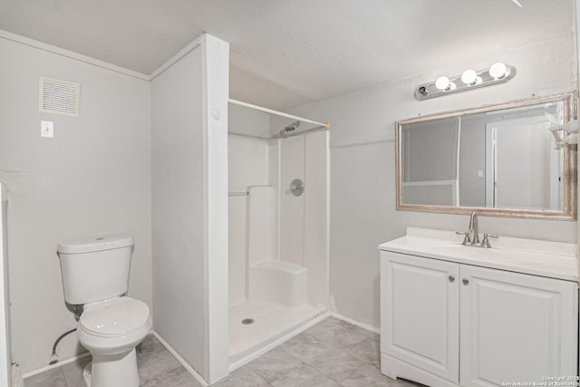 bathroom with vanity, a textured ceiling, toilet, and a shower