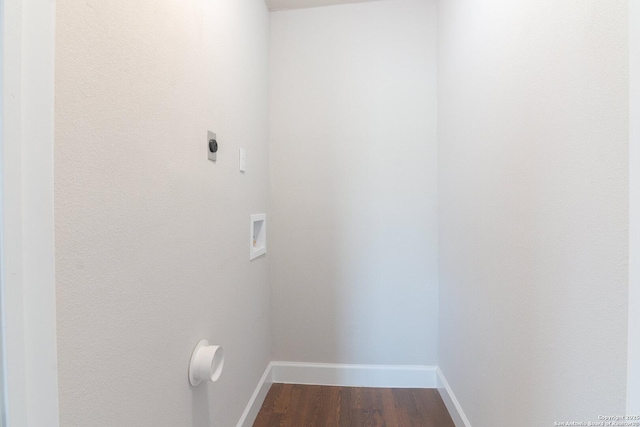 washroom with dark hardwood / wood-style flooring, hookup for a washing machine, and hookup for an electric dryer