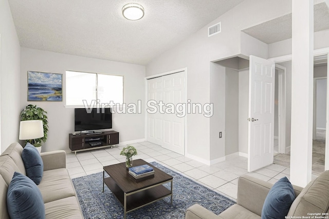 living room with light tile patterned flooring, vaulted ceiling, a chandelier, and a textured ceiling