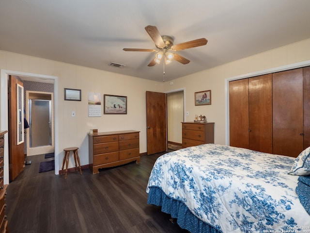 bedroom with ceiling fan, dark hardwood / wood-style flooring, and a closet