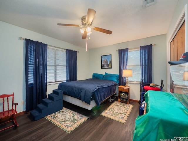 bedroom featuring dark hardwood / wood-style floors and ceiling fan