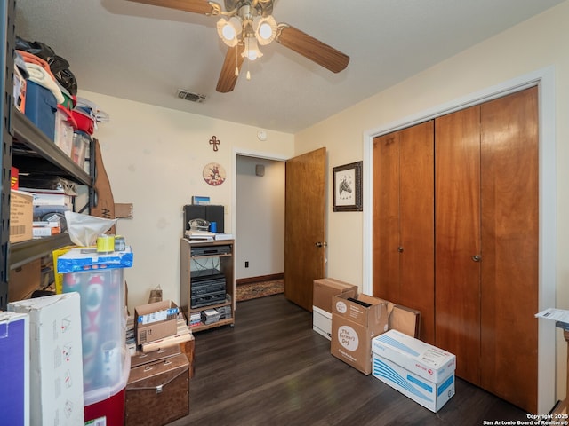 interior space featuring ceiling fan and dark hardwood / wood-style floors