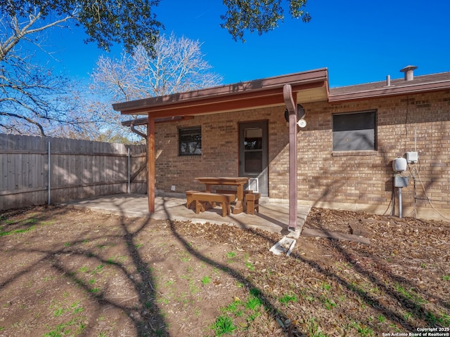 back of house with a patio