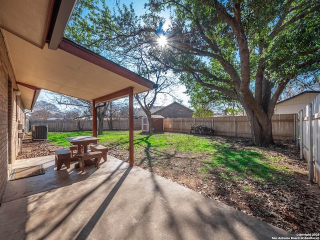 view of patio featuring cooling unit and a storage unit