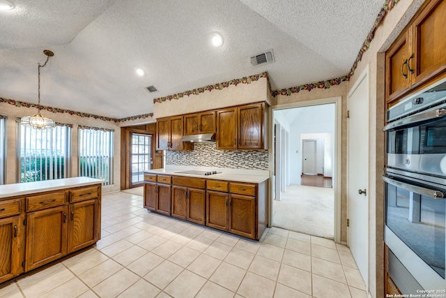 kitchen featuring vaulted ceiling, hanging light fixtures, light tile patterned floors, stainless steel double oven, and black electric cooktop