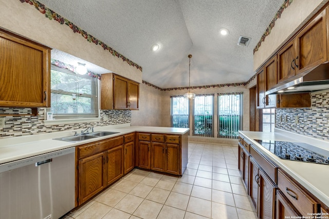 kitchen with decorative light fixtures, lofted ceiling, sink, stainless steel dishwasher, and kitchen peninsula