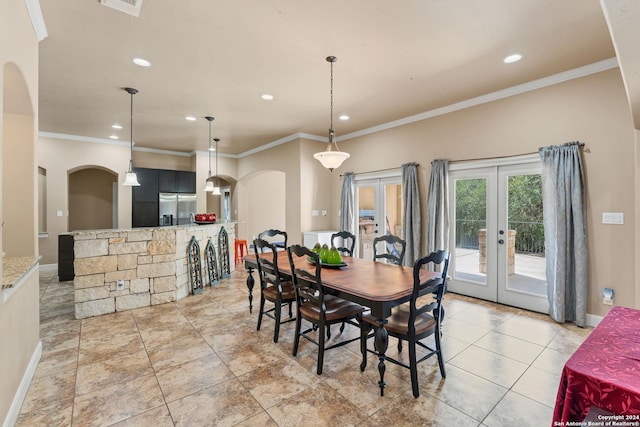 dining area with french doors and ornamental molding