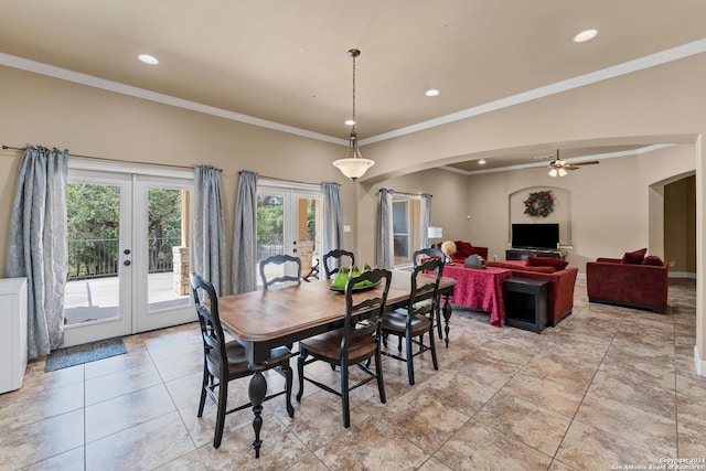 tiled dining area with ornamental molding, french doors, and ceiling fan