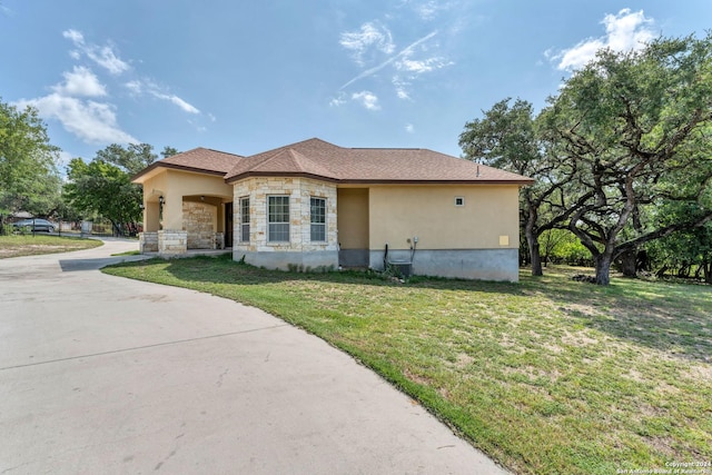 view of side of home featuring a lawn