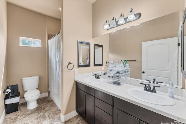 bathroom featuring vanity, toilet, and tile patterned flooring