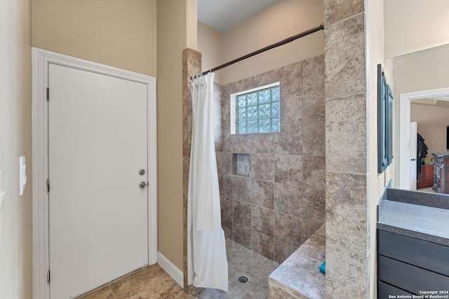 bathroom with vanity and curtained shower