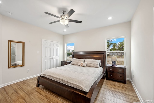 bedroom featuring ceiling fan and a closet