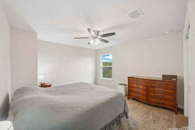 bedroom with ceiling fan and carpet floors