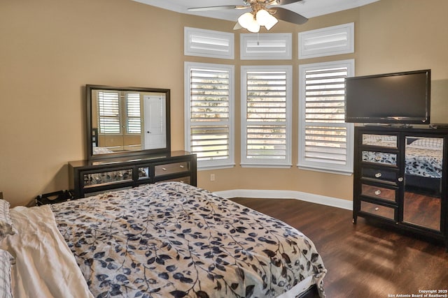 bedroom with dark wood-type flooring and crown molding