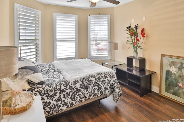 bedroom featuring dark wood-type flooring and ceiling fan