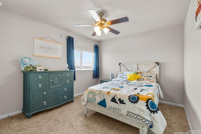 bedroom featuring light carpet and ceiling fan