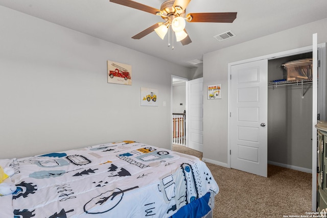 bedroom with a closet, ceiling fan, and carpet