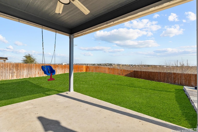 view of yard featuring a patio and ceiling fan