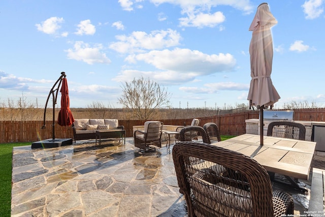 view of patio with grilling area and an outdoor living space