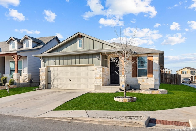 view of front of home with a garage and a front lawn