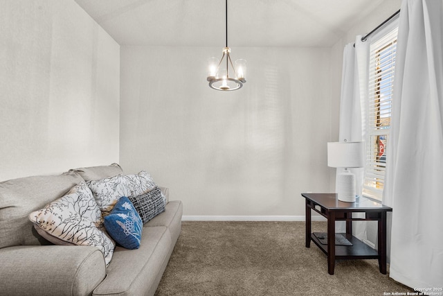 living room featuring a chandelier and carpet