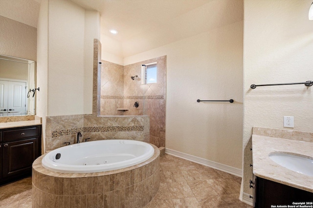 bathroom featuring separate shower and tub and vanity