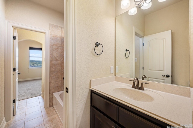 bathroom featuring vanity, tile patterned flooring, and shower / bathtub combination