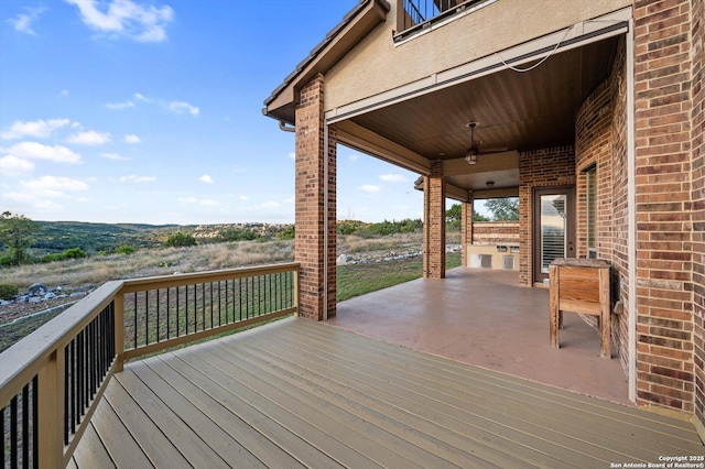 deck featuring a patio and ceiling fan