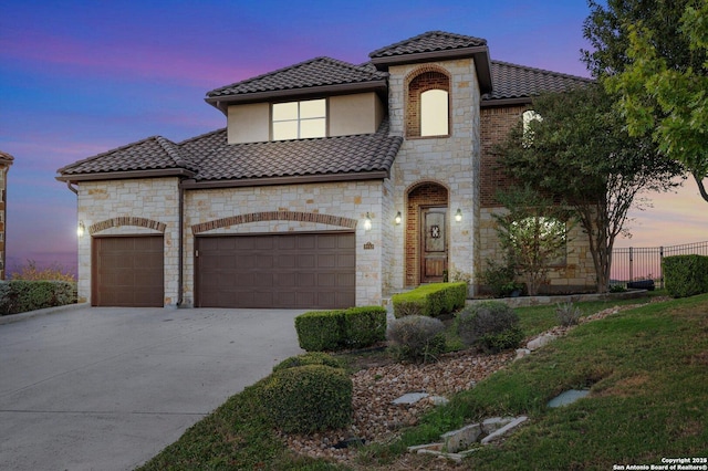 mediterranean / spanish-style house featuring a garage