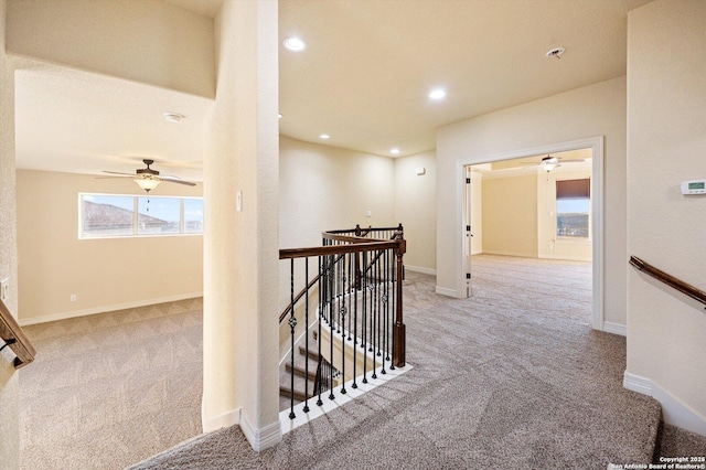 corridor featuring light colored carpet